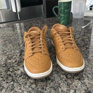 Tennis shoes. Good quality. Never used. Nike. Tan color. Leather. Size 7